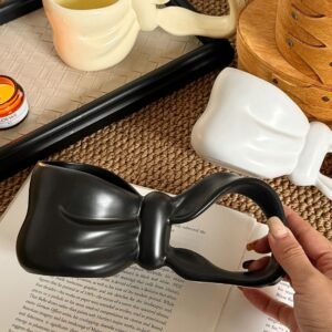 "3D Bow-Tie Ceramic Mug: Chic Sculptural Design for Stylish Sipping"
